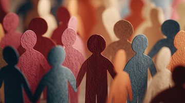 paper figurines hold hands in a circle