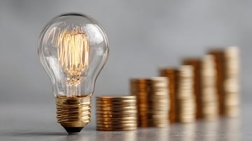 Image of a lightbulb and stacked coins